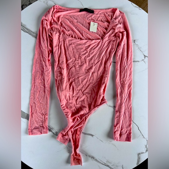 Francesca's Collections Tops - Francesca's Collections Pink Long Sleeve Bodysuit